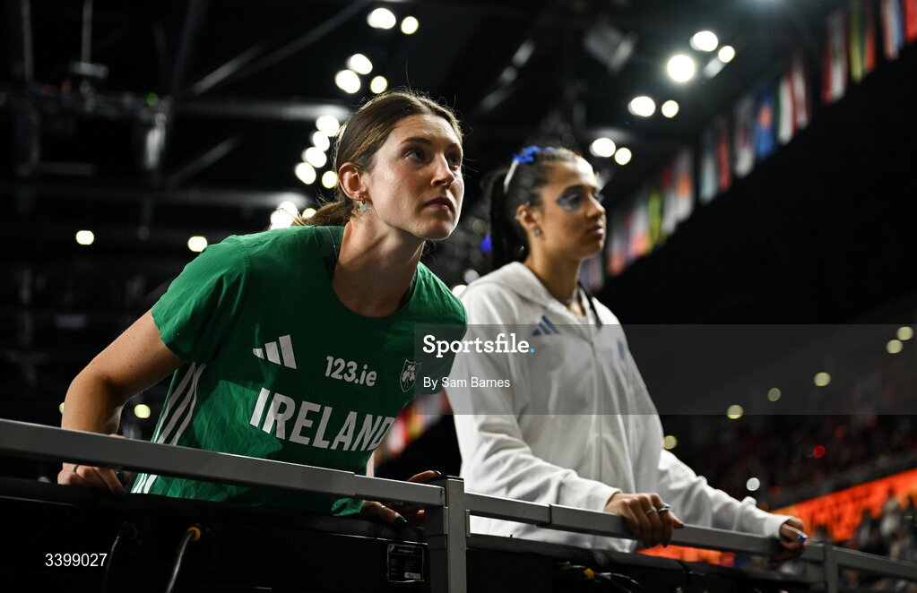 22 March 2026; Kate O'Connor of Ireland speaks to her coaches before competing in the Women's high jump in the Women's Pentathlon during day three of the World Athletics Indoor Championships at Kujawsko-Pomorska Arena in Torun, Poland. Photo by Sam Barnes/Sportsfile
