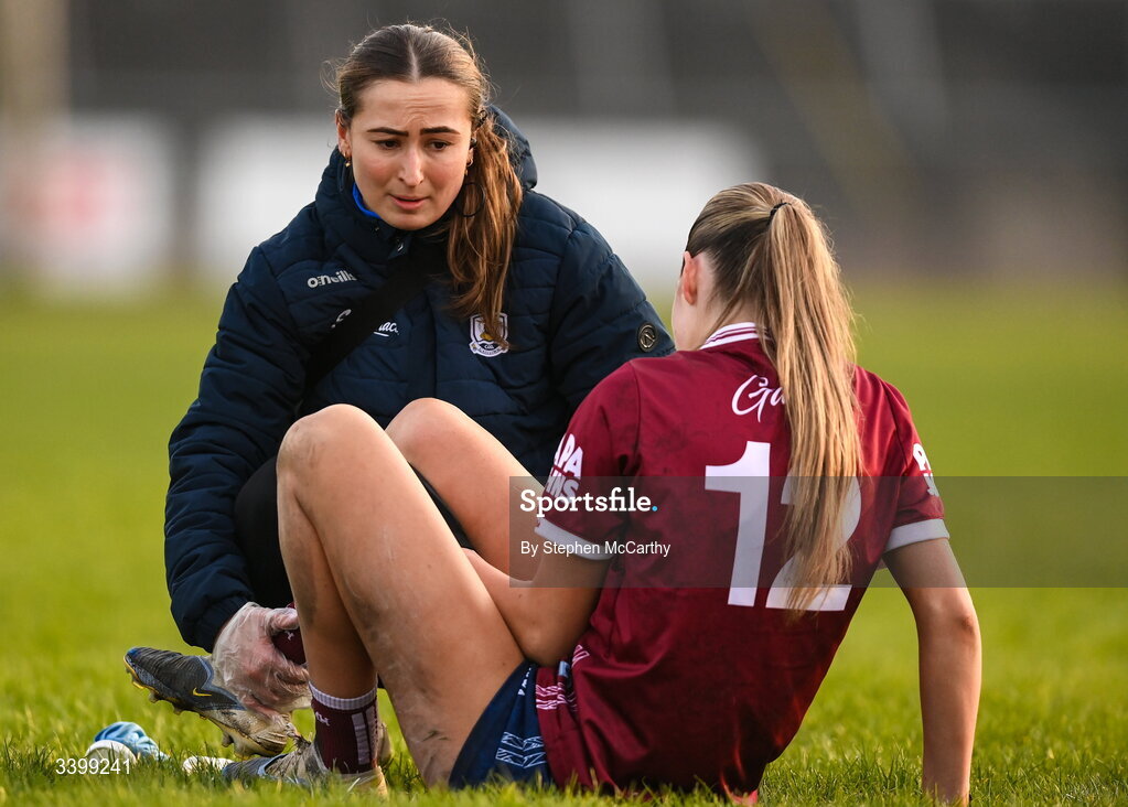21 March 2026; Galway physiotherapist Rachel Keane attends to Kate Thompson of Galway during the Lidl Ladies National Football League Division 1 Round 6 match between Galway and Dublin at Tuam Stadium in Tuam, Galway. Photo by Stephen McCarthy/Sportsfile
