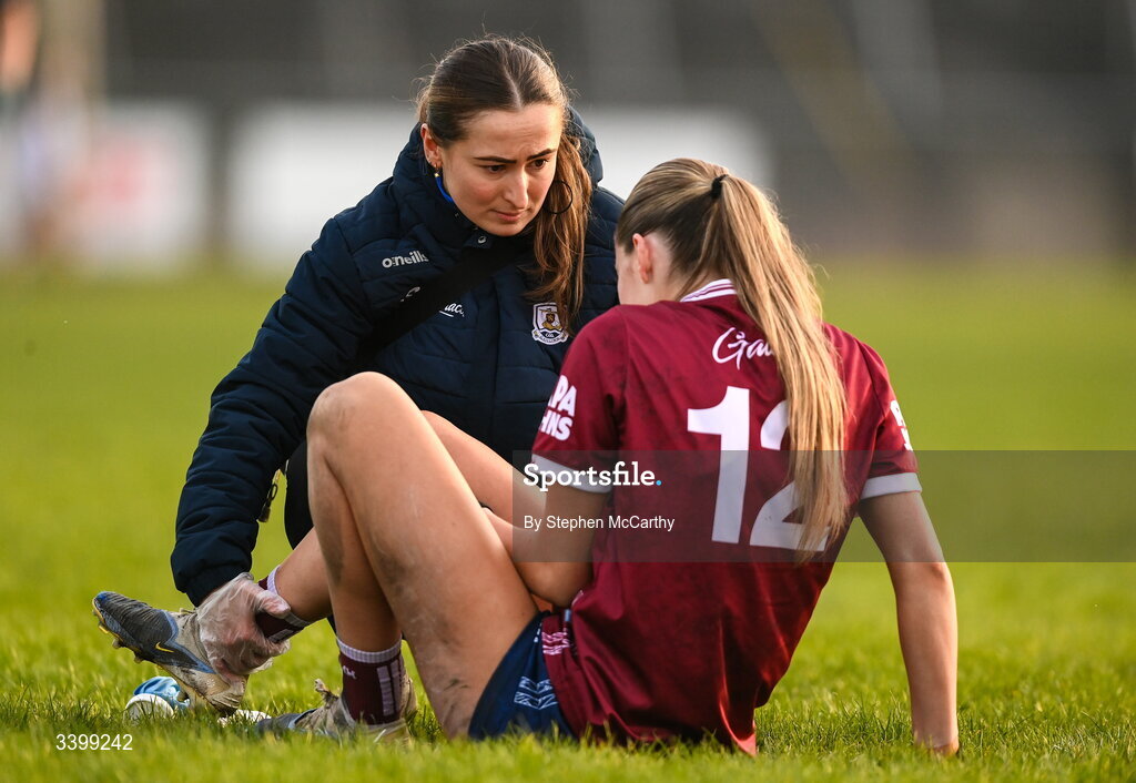 21 March 2026; Galway physiotherapist Rachel Keane attends to Kate Thompson of Galway during the Lidl Ladies National Football League Division 1 Round 6 match between Galway and Dublin at Tuam Stadium in Tuam, Galway. Photo by Stephen McCarthy/Sportsfile