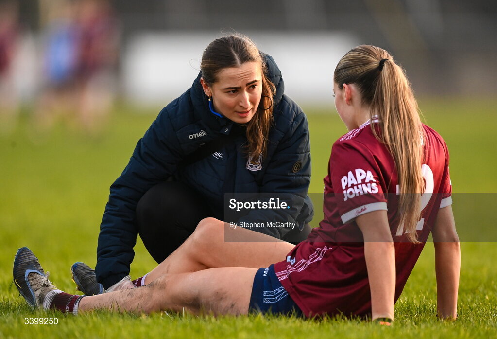 21 March 2026; Galway physiotherapist Rachel Keane attends to Kate Thompson of Galway during the Lidl Ladies National Football League Division 1 Round 6 match between Galway and Dublin at Tuam Stadium in Tuam, Galway. Photo by Stephen McCarthy/Sportsfile