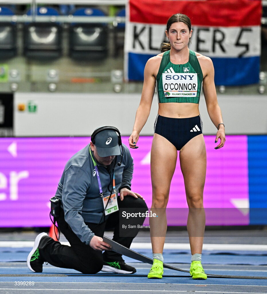 22 March 2026; Kate O'Connor of Ireland prepares to compete in the Women's high jump event, as officials fix the track, in the Women's Pentathlon during day three of the World Athletics Indoor Championships at Kujawsko-Pomorska Arena in Torun, Poland. Photo by Sam Barnes/Sportsfile