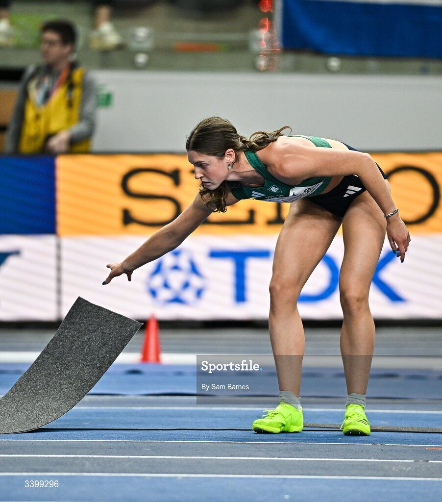 22 March 2026; Kate O'Connor of Ireland moves the floor tiles while competing in the Women's high jump event in the Women's Pentathlon during day three of the World Athletics Indoor Championships at Kujawsko-Pomorska Arena in Torun, Poland. Photo by Sam Barnes/Sportsfile