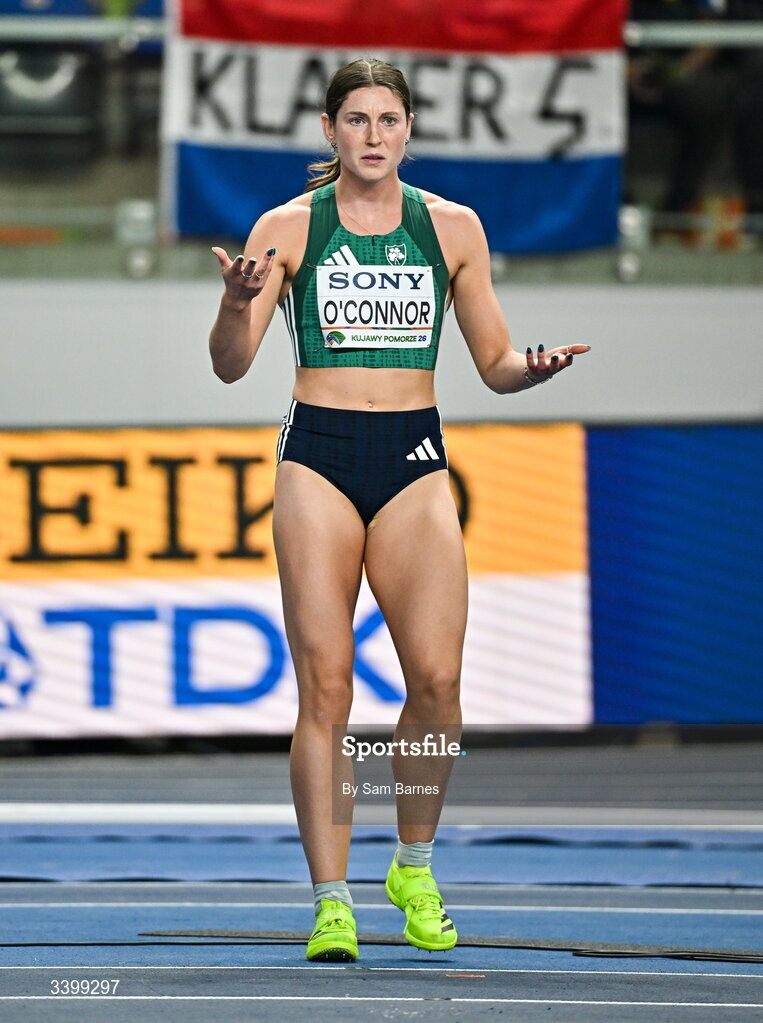 22 March 2026; Kate O'Connor of Ireland reacts after tripping on the floor tiles while competing in the Women's high jump event in the Women's Pentathlon during day three of the World Athletics Indoor Championships at Kujawsko-Pomorska Arena in Torun, Poland. Photo by Sam Barnes/Sportsfile