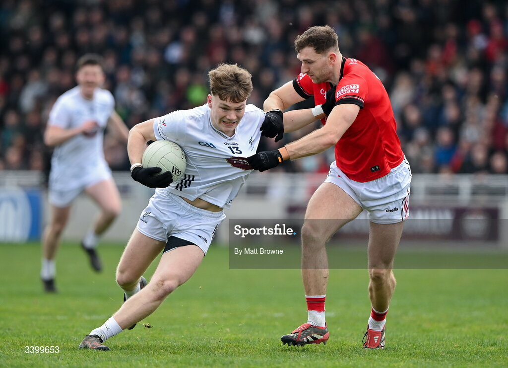 22 March 2026; Colm Moran of Kildare in action against Sam Milroy of Louth during the Allianz Football League Division 2 match between Kildare and Louth at Cedral St Conleth's Park in Newbridge, Kildare. Photo by Matt Browne/Sportsfile