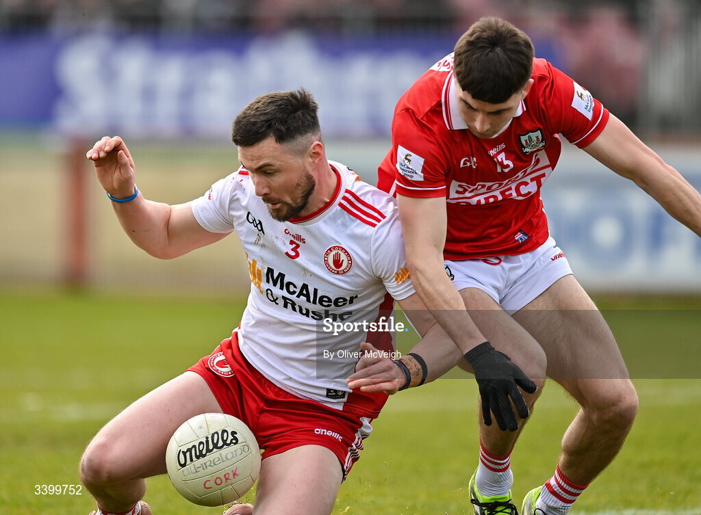 22 March 2026; Peter Teague of Tyrone in action against Chris Og Jones of Cork during the Allianz Football League Division 2 match between Tyrone and Cork at O'Neills Healy Park in Omagh, Tyrone. Photo by Oliver McVeigh/Sportsfile