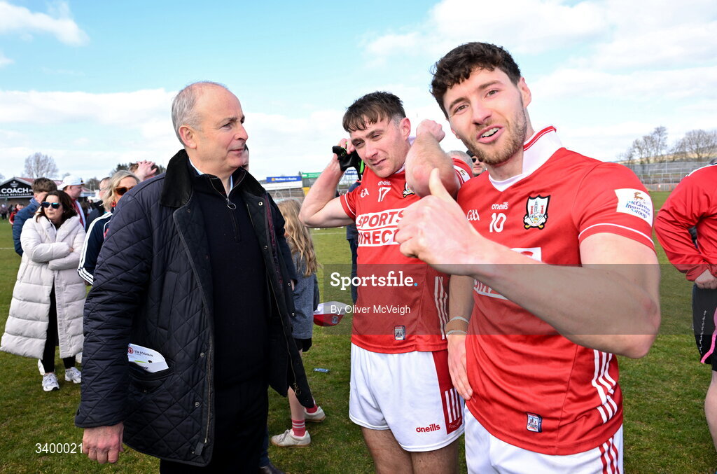 22 March 2026; An Taoiseach Micheál Martin TD along with Sean Meehan and Paul Walsh of Cork after the Allianz Football League Division 2 match between Tyrone and Cork at O'Neills Healy Park in Omagh, Tyrone. Photo by Oliver McVeigh/Sportsfile