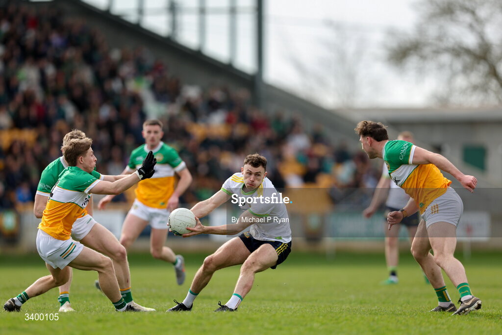 22 March 2026; Jordan Morris of Meath in action against Lee Pearson, left, and Jordan Hayes of Offaly during the Allianz Football League Division 2 match between Offaly and Meath at Glenisk O'Connor Park in Tullamore, Offaly. Photo by Michael P Ryan/Sportsfile