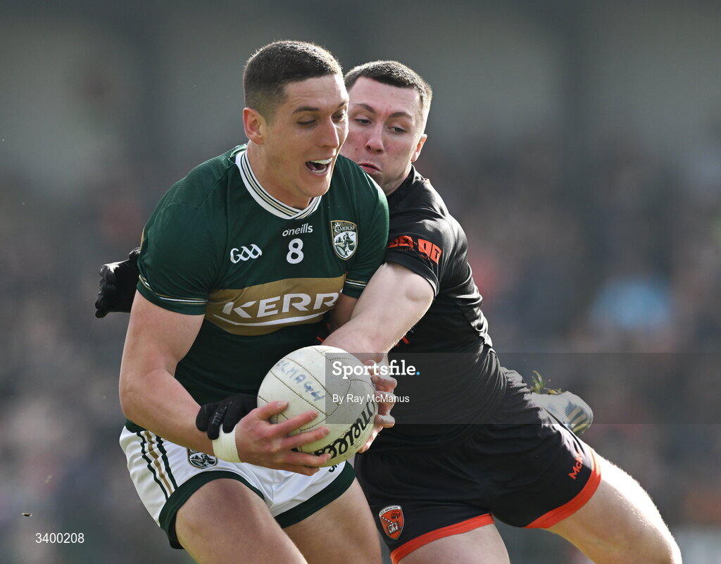 22 March 2026; Joe O'Connor of Kerry is tackled by Oisín Conaty of Armagh during the Allianz Football League Division 1 match between Armagh and Kerry at BOX-IT Athletic Grounds in Armagh. Photo by Ray McManus/Sportsfile