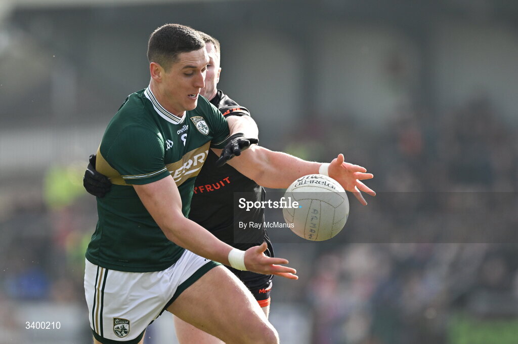 22 March 2026; Joe O'Connor of Kerry is tackled by Oisín Conaty of Armagh during the Allianz Football League Division 1 match between Armagh and Kerry at BOX-IT Athletic Grounds in Armagh. Photo by Ray McManus/Sportsfile