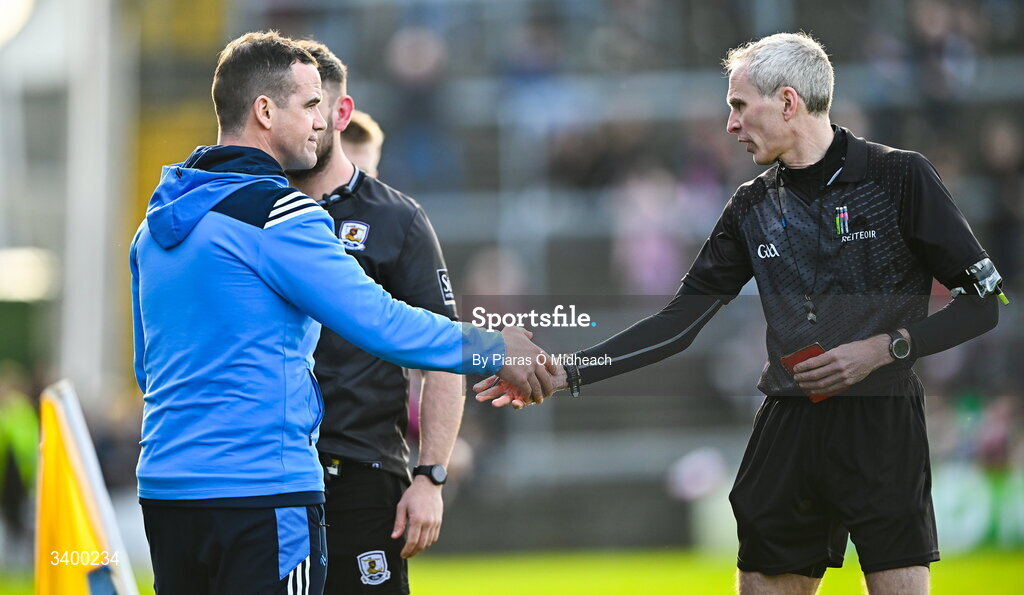 22 March 2026; Dublin manager Ger Brennan shakes hands with referee Fergal Kelly, after Brennan and Galway strength and conditioning coach Cian Breathnach McGinn were sent off before the start of the second half, during the Allianz Football League Division 1 match between Galway and Dublin at Pearse Stadium in Galway. Photo by Piaras Ó Mídheach/Sportsfile