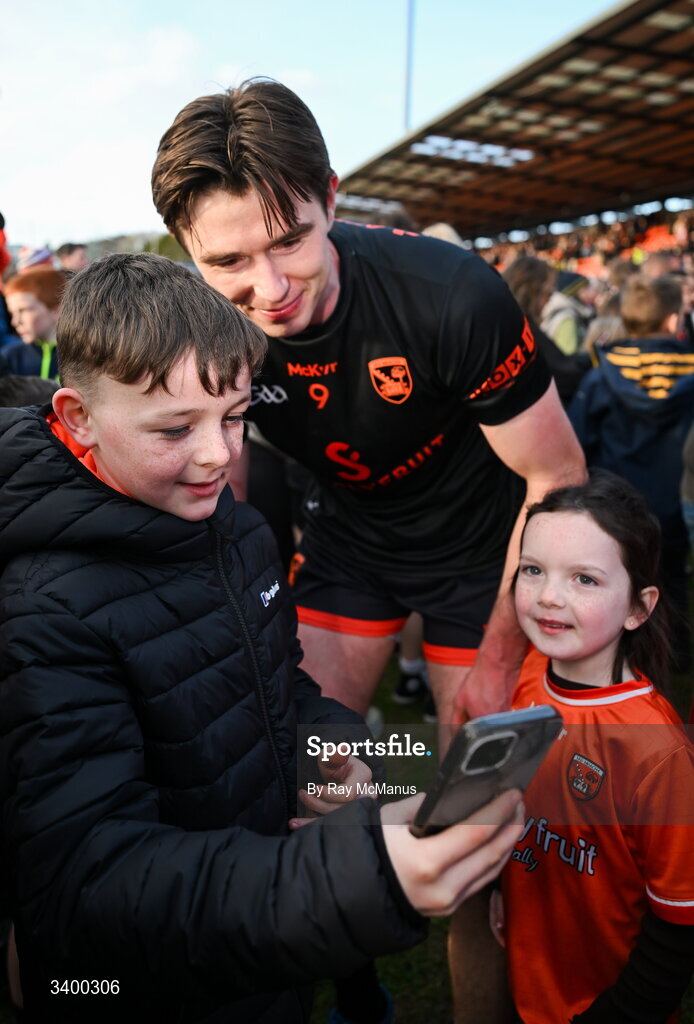 22 March 2026; Ben Crealey of Armagh poses for a selfie with a young supporter after the Allianz Football League Division 1 match between Armagh and Kerry at BOX-IT Athletic Grounds in Armagh. Photo by Ray McManus/Sportsfile