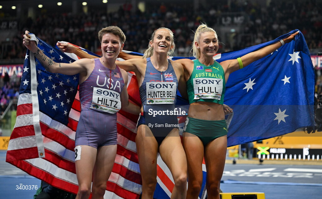 22 March 2026; Women's 1500m final medallists, from left, third place Nikki Hiltz of United States, winner Georgia Hunter Bell of Great Britain and second place Jessica Hull of Australia during day three of the World Athletics Indoor Championships at Kujawsko-Pomorska Arena in Torun, Poland. Photo by Sam Barnes/Sportsfile