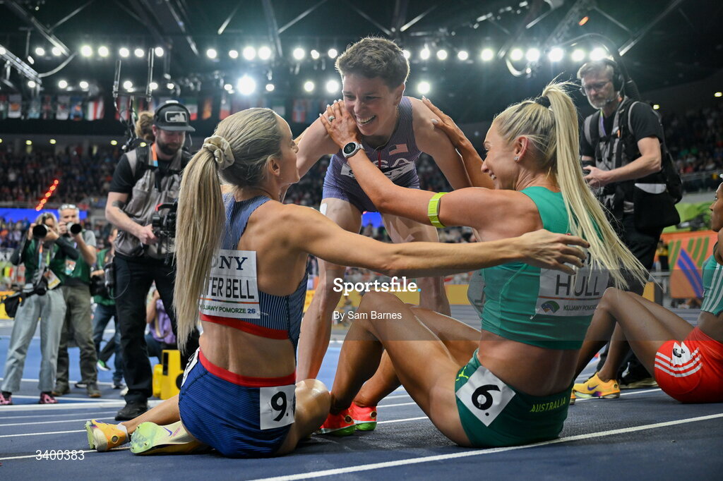 22 March 2026; Women's 1500m medallists from left, winner Georgia Hunter Bell of Great Britain, third place Nikki Hiltz of United States and Jessica Hull of Australia embrace during day three of the World Athletics Indoor Championships at Kujawsko-Pomorska Arena in Torun, Poland. Photo by Sam Barnes/Sportsfile