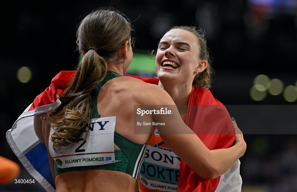 22 March 2026; Kate O'Connor of Ireland, left, with Sofie Dokter of Netherlands embrace after the Women's Pentathlon during day three of the World Athletics Indoor Championships at Kujawsko-Pomorska Arena in Torun, Poland. Photo by Sam Barnes/Sportsfile