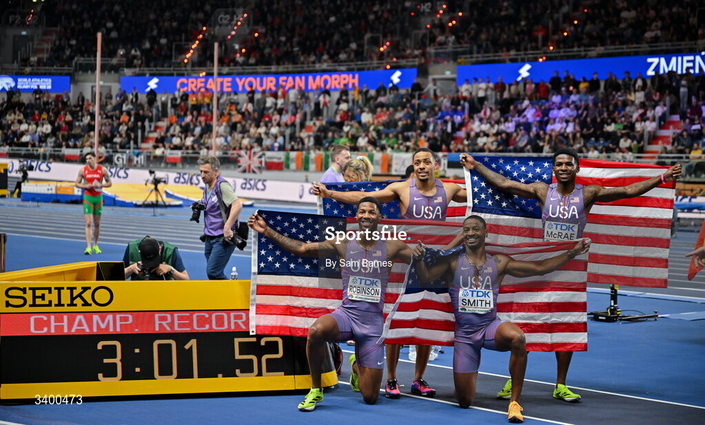 22 March 2026; The United States Relay team, from left, Chris Robinson, Justin Robinson, Demarius Smith and Khaleb McRae after winning the Men's 4x400m Relay, with a Championship Record time of 3:01.52, during day three of the World Athletics Indoor Championships at Kujawsko-Pomorska Arena in Torun, Poland. Photo by Sam Barnes/Sportsfile