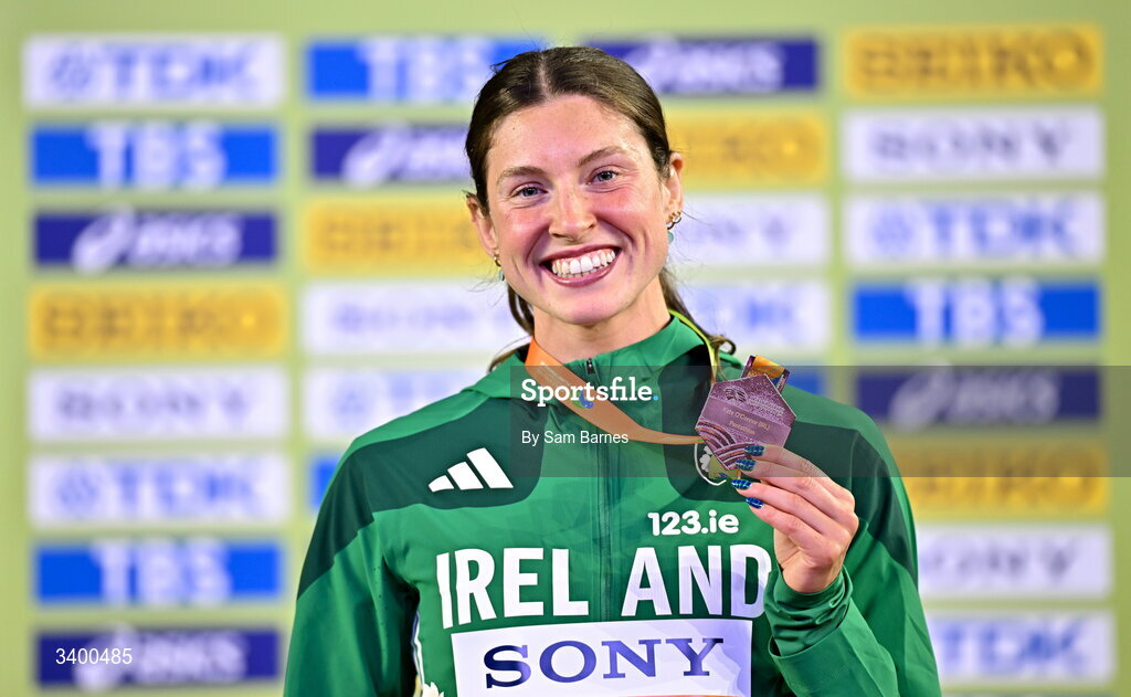 22 March 2026; Kate O'Connor of Ireland celebrates with her bronze medal from the Women's Pentathlon during day three of the World Athletics Indoor Championships at Kujawsko-Pomorska Arena in Torun, Poland. Photo by Sam Barnes/Sportsfile