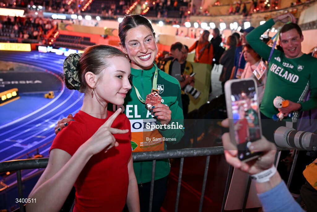 22 March 2026; Women's Pentathlon bronze medallist Kate O'Connor of Ireland poses for photos with supporters after day three of the World Athletics Indoor Championships at Kujawsko-Pomorska Arena in Torun, Poland. Photo by Sam Barnes/Sportsfile