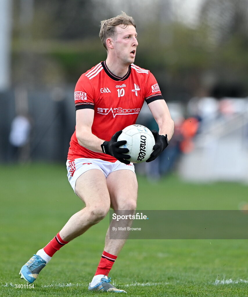 22 March 2026; Paul Matthews of Louth in action against YYYY of Kildare during the Allianz Football League Division 2 match between Kildare and Louth at Cedral St Conleth's Park in Newbridge, Kildare. Photo by Matt Browne/Sportsfile