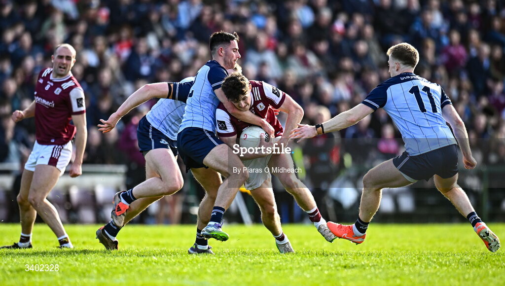 22 March 2026; Kieran Molloy of Galway in action against Niall Scully and Seán Bugler, 11, of Dublin during the Allianz Football League Division 1 match between Galway and Dublin at Pearse Stadium in Galway. Photo by Piaras Ó Mídheach/Sportsfile