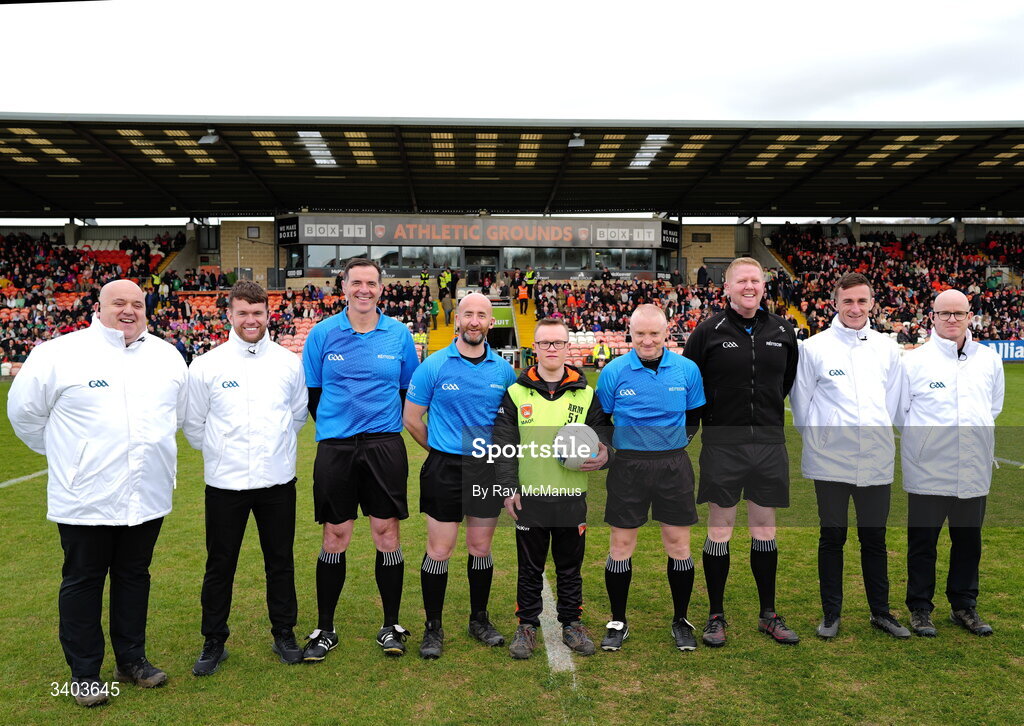 22 March 2026; Referee Brendan Cawley with his officials and 'ball boy' Micheál McCloy before the Allianz Football League Division 1 match between Armagh and Kerry at BOX-IT Athletic Grounds in Armagh. Photo by Ray McManus/Sportsfile