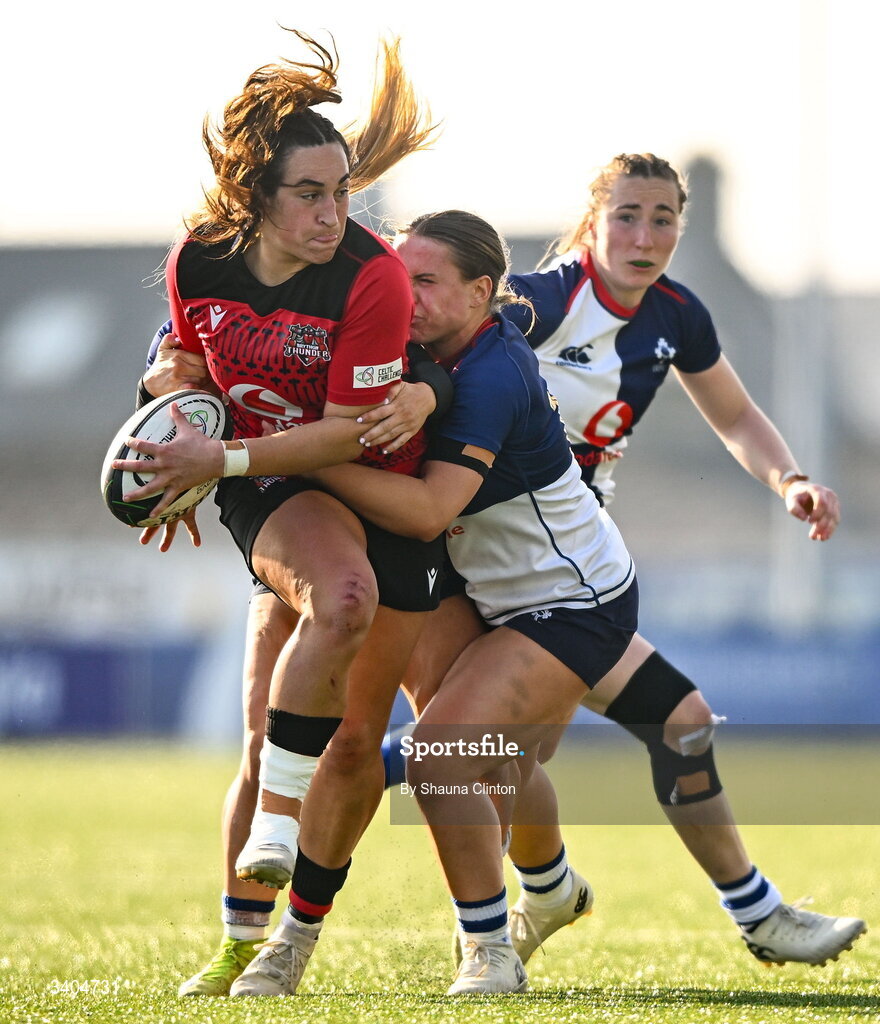 21 March 2026; Courtney Keight of Brython Thunder is tackled by Wolfhounds players Aoife Dalton, left, and Robyn O'Connor during the Celtic Challenge semi-final match between Wolfhounds and Brython Thunder at Dexcom Stadium in Galway. Photo by Shauna Clinton/Sportsfile