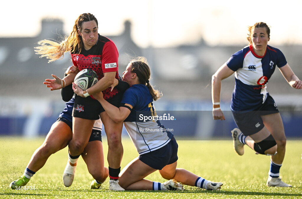 21 March 2026; Courtney Keight of Brython Thunder is tackled by Wolfhounds players Aoife Dalton, left, and Robyn O'Connor during the Celtic Challenge semi-final match between Wolfhounds and Brython Thunder at Dexcom Stadium in Galway. Photo by Shauna Clinton/Sportsfile