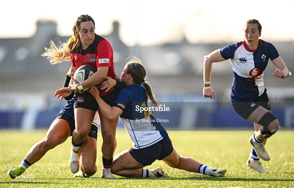 21 March 2026; Courtney Keight of Brython Thunder is tackled by Wolfhounds players Aoife Dalton, left, and Robyn O'Connor during the Celtic Challenge semi-final match between Wolfhounds and Brython Thunder at Dexcom Stadium in Galway. Photo by Shauna Clinton/Sportsfile