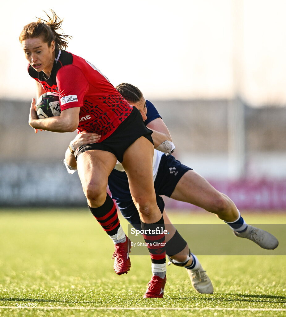 21 March 2026; Lisa Neumann of Brython Thunder is tackled by Eve Higgins of Wolfhounds during the Celtic Challenge semi-final match between Wolfhounds and Brython Thunder at Dexcom Stadium in Galway. Photo by Shauna Clinton/Sportsfile