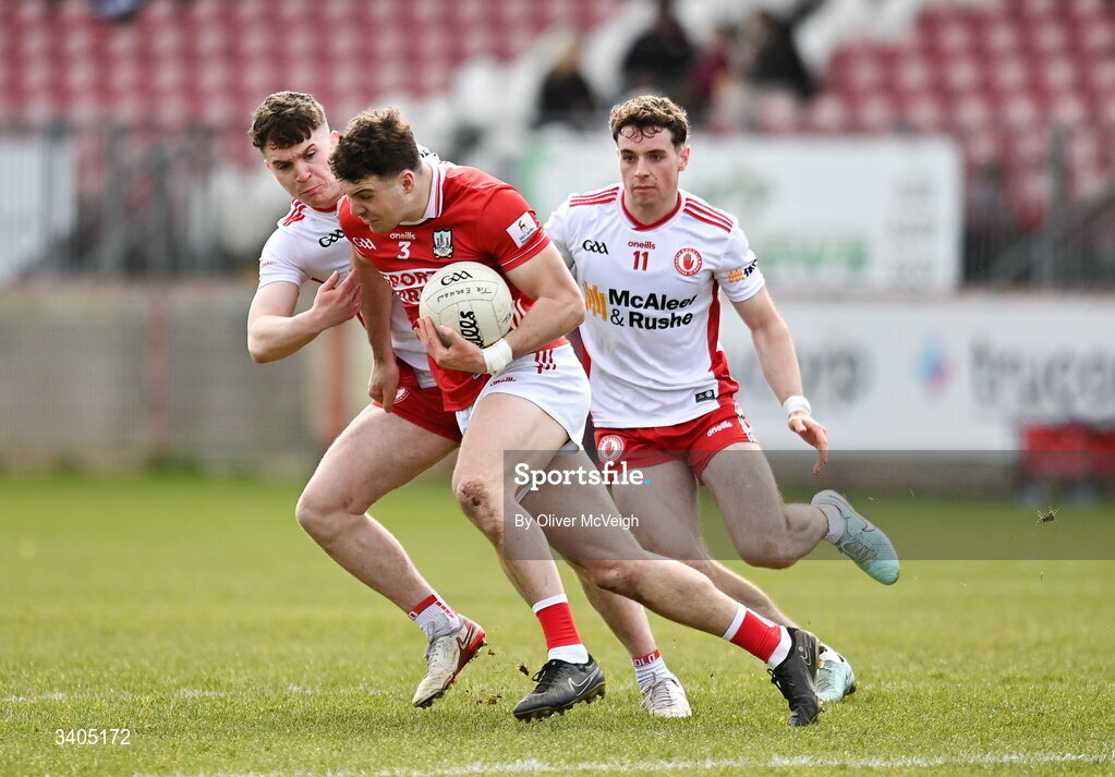 22 March 2026; Daniel O"Mahony of Cork in action against Eoin McElholm and Ronan Cassidy  of Tyrone during the Allianz Football League Division 2 match between Tyrone and Cork at O'Neills Healy Park in Omagh, Tyrone. Photo by Oliver McVeigh/Sportsfile