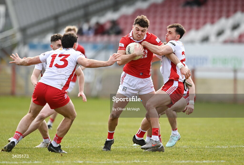 22 March 2026; Daniel O"Mahony of Cork in action against Darren McCurry and Darragh Canavan of Tyrone  during the Allianz Football League Division 2 match between Tyrone and Cork at O'Neills Healy Park in Omagh, Tyrone. Photo by Oliver McVeigh/Sportsfile