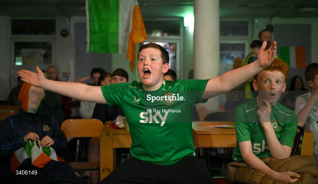 26 March 2026; Republic of Ireland supporters Jessie Loj, left, and Cameron Kinsella react as they watch the FIFA World Cup 2026 European Qualifiers play-off semi-final match between Czechia and Republic of Ireland at Fortuna Arena in Prague, Czechia, on a giant screen in O'Connell Secondary School, North Circular Road in Dublin. Photo by Ray McManus/Sportsfile