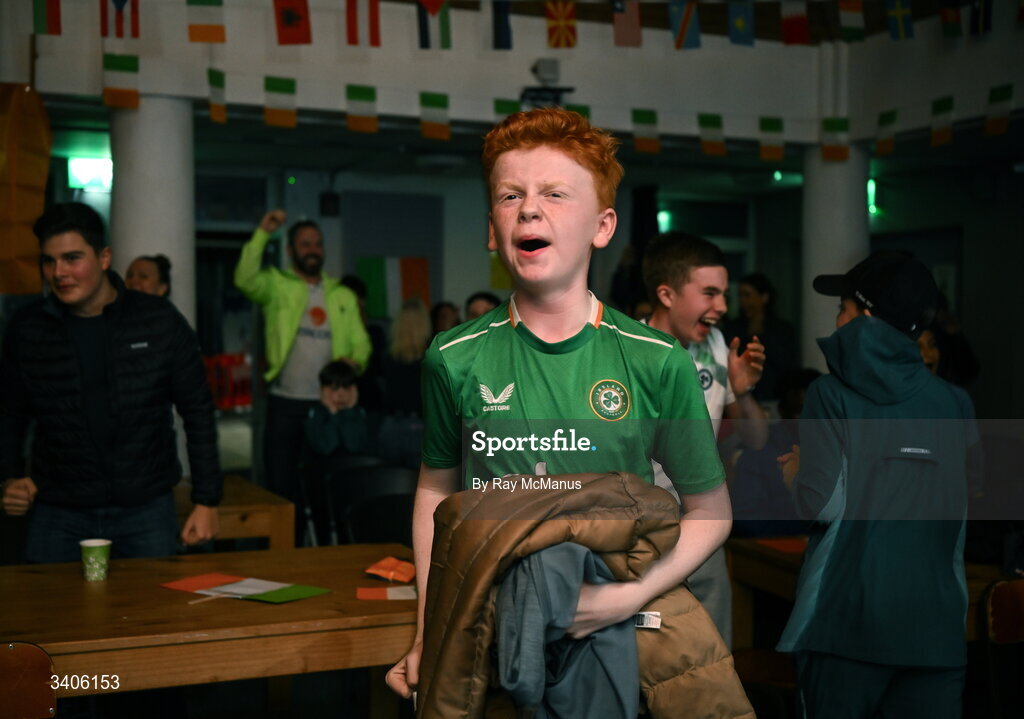 26 March 2026; Republic of Ireland supporter Cameron Kinsella reacts to an Ireland goal as he watches the FIFA World Cup 2026 European Qualifiers play-off semi-final match between Czechia and Republic of Ireland at Fortuna Arena in Prague, Czechia, on a giant screen in O'Connell Secondary School, North Circular Road in Dublin. Photo by Ray McManus/Sportsfile