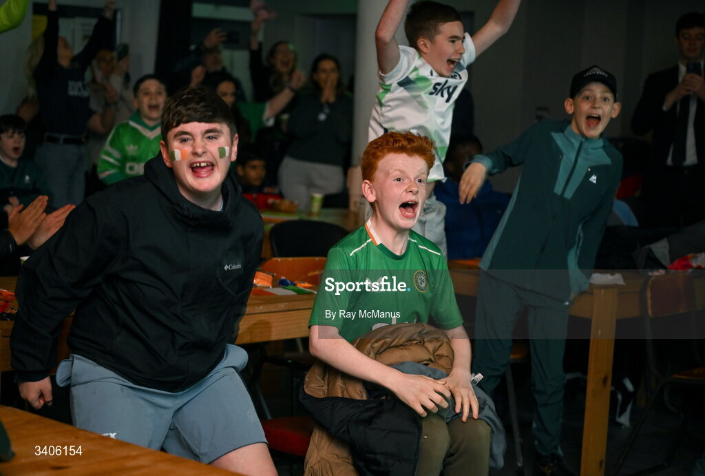 26 March 2026; Republic of Ireland supporters react to an Ireland goal as they watch the FIFA World Cup 2026 European Qualifiers play-off semi-final match between Czechia and Republic of Ireland at Fortuna Arena in Prague, Czechia, on a giant screen in O'Connell Secondary School, North Circular Road in Dublin. Photo by Ray McManus/Sportsfile