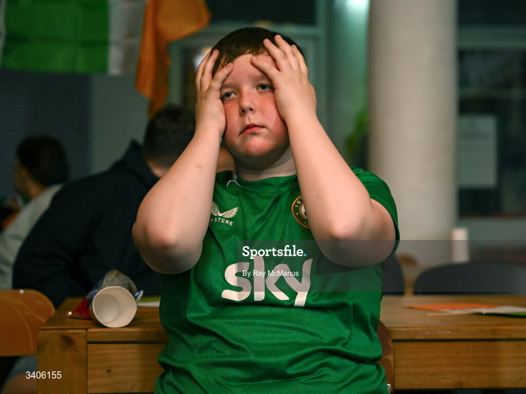 26 March 2026; Republic of Ireland supporter Jessie Loj reacts as he watches the FIFA World Cup 2026 European Qualifiers play-off semi-final match between Czechia and Republic of Ireland at Fortuna Arena in Prague, Czechia, on a giant screen in O'Connell Secondary School, North Circular Road in Dublin. Photo by Ray McManus/Sportsfile