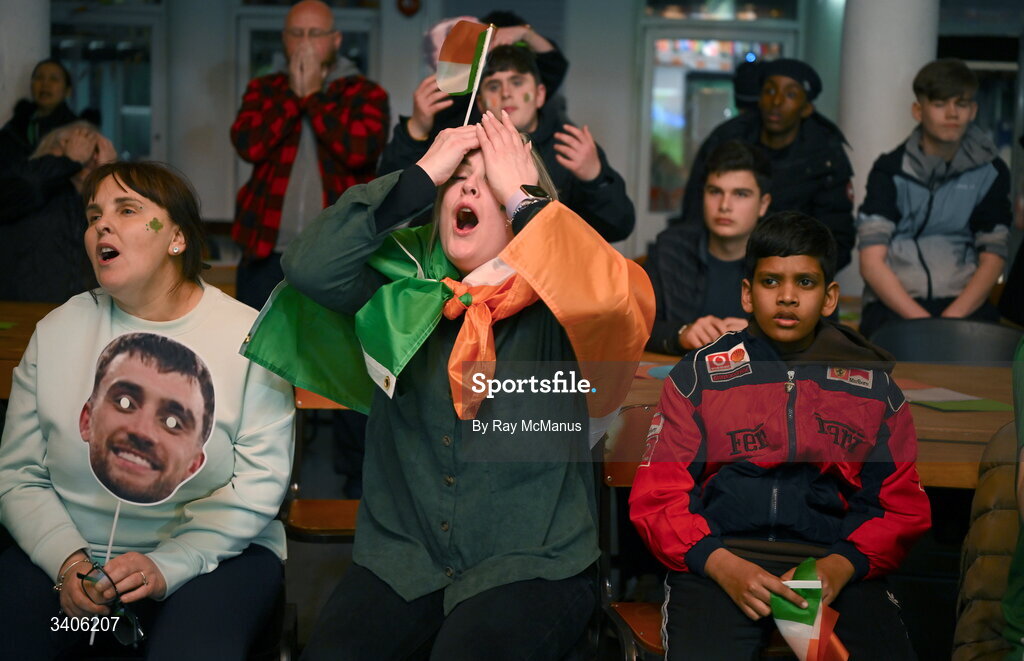 26 March 2026; Republic of Ireland supporters, including Maeve Bergin, centre, react as they watch the penalties after FIFA World Cup 2026 European Qualifiers play-off semi-final match between Czechia and Republic of Ireland at Fortuna Arena in Prague, Czechia, on a giant screen in O'Connell Secondary School, North Circular Road in Dublin. Photo by Ray McManus/Sportsfile