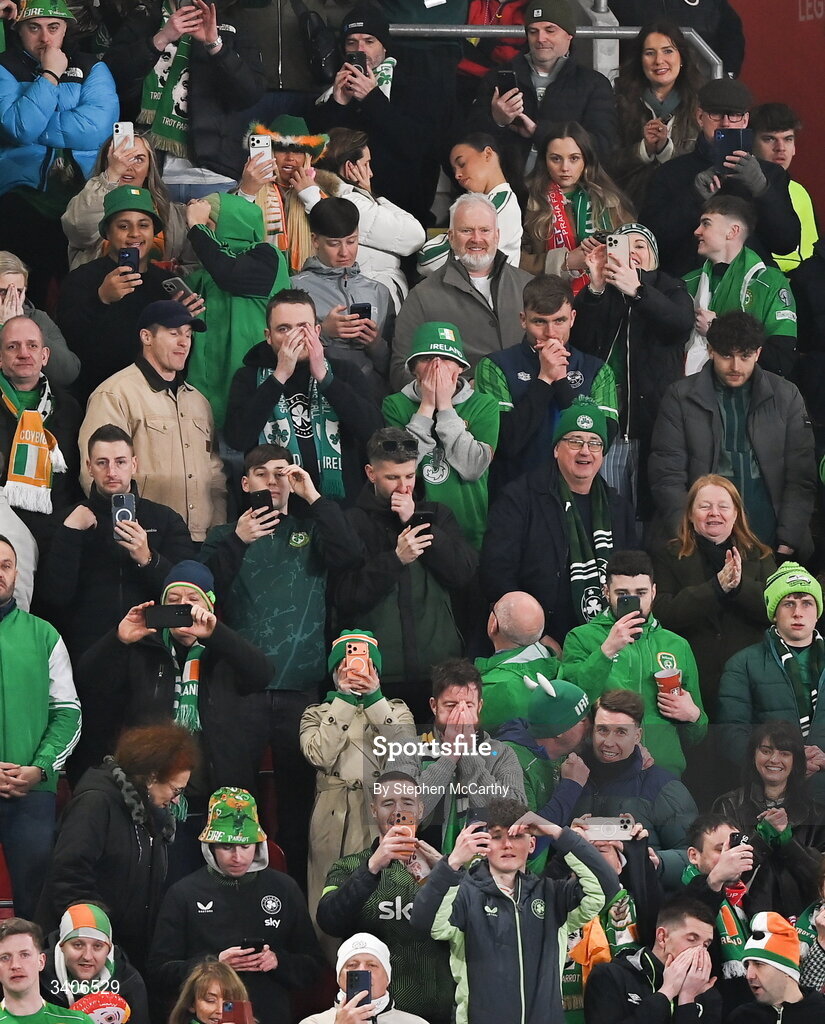 26 March 2026; Republic of Ireland supporters, including Troy Parrott's mother Jennifer and his partner Lauren Bowry, top, react as Troy Parrott, not pictured, awaits to take a first half penalty kick during the FIFA World Cup 2026 European Qualifiers play-off semi-final match between Czechia and Republic of Ireland at Fortuna Arena in Prague, Czechia. Photo by Stephen McCarthy/Sportsfile
