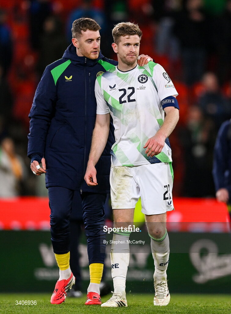 26 March 2026; Mark Travers, left, and Nathan Collins of Republic of Ireland following their penalty shootout defeat in the FIFA World Cup 2026 European Qualifiers play-off semi-final match between Czechia and Republic of Ireland at Fortuna Arena in Prague, Czechia. Photo by Stephen McCarthy/Sportsfile