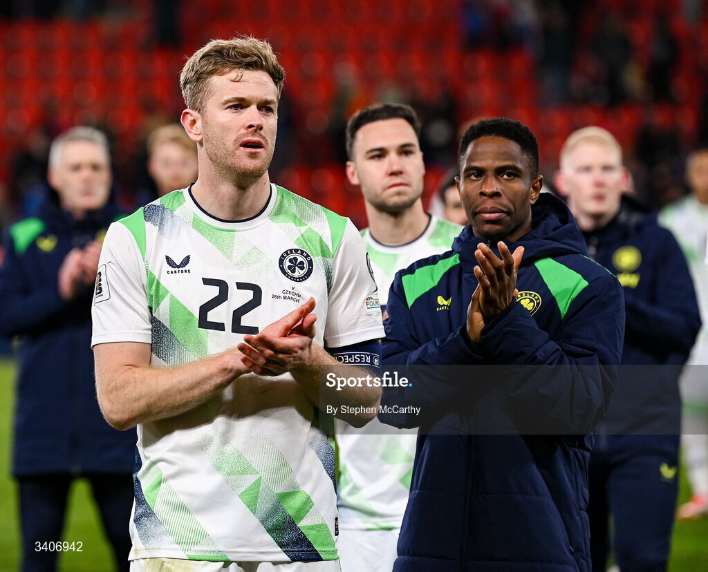 26 March 2026; Nathan Collins and Chiedozie Ogbene, right, of Republic of Ireland following their penalty shootout defeat in the FIFA World Cup 2026 European Qualifiers play-off semi-final match between Czechia and Republic of Ireland at Fortuna Arena in Prague, Czechia. Photo by Stephen McCarthy/Sportsfile