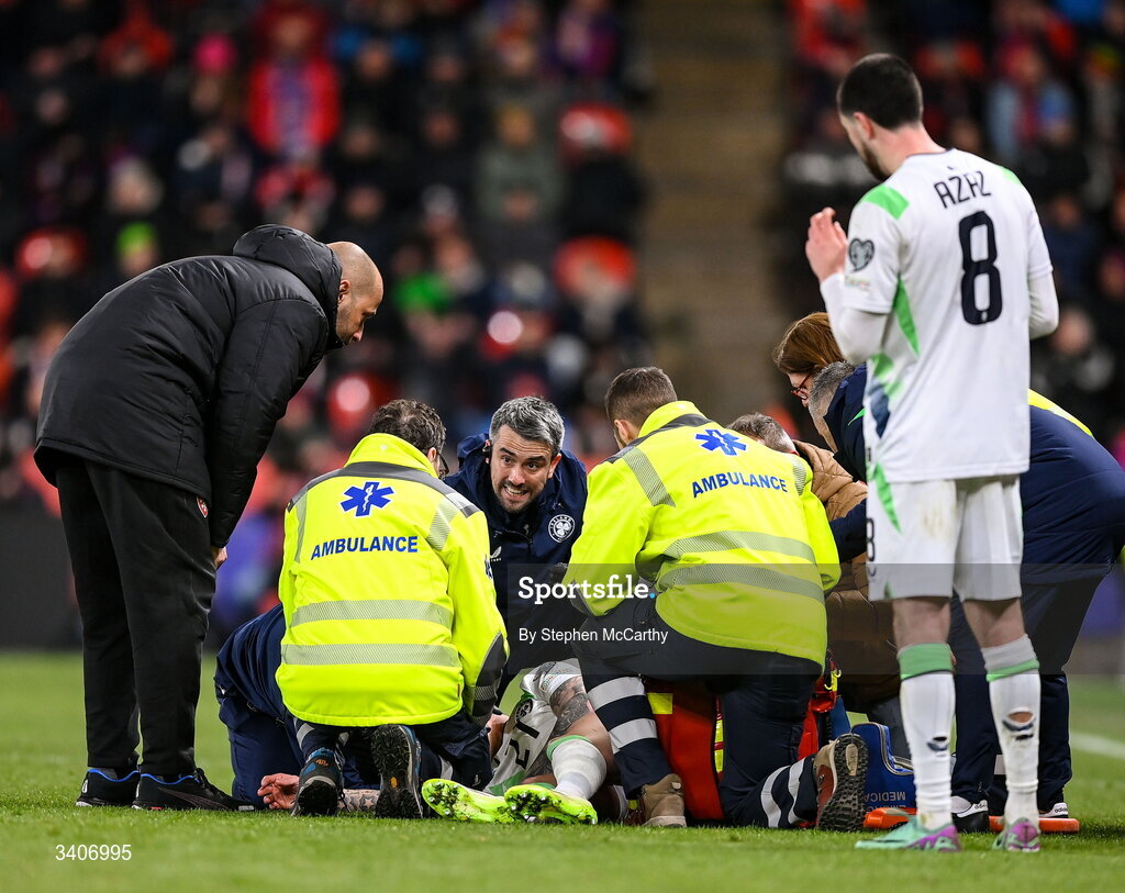 26 March 2026; Republic of Ireland team doctor Sean Carmody treats Sammie Szmodics during the FIFA World Cup 2026 European Qualifiers play-off semi-final match between Czechia and Republic of Ireland at Fortuna Arena in Prague, Czechia. Photo by Stephen McCarthy/Sportsfile