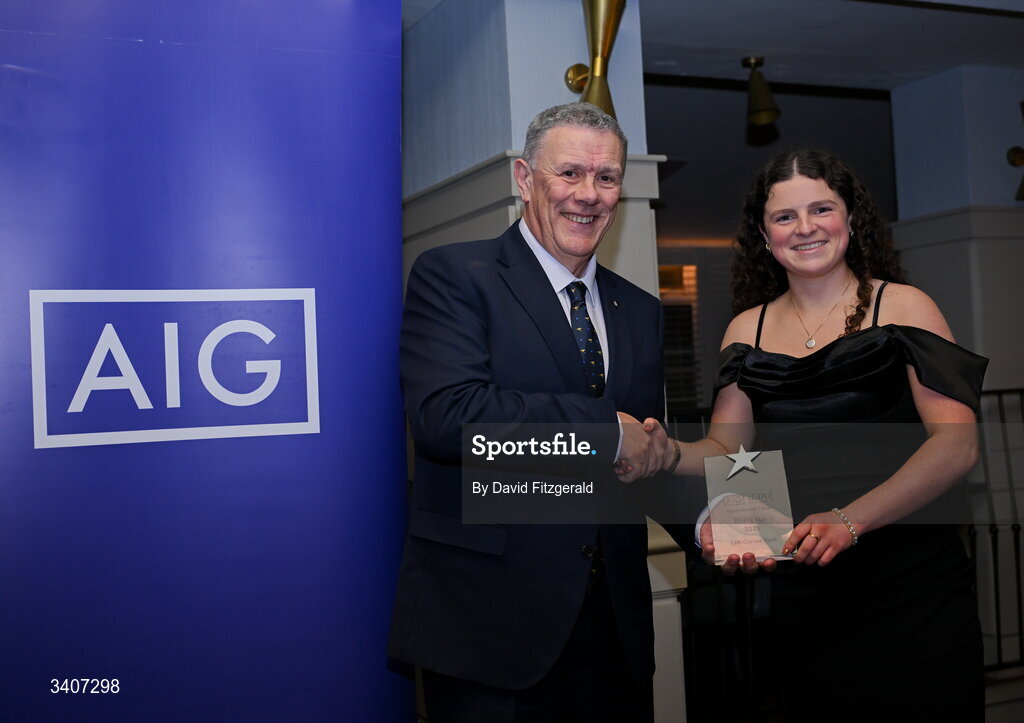 27 March 2026; Aoibhe Ryan of SETU Carlow is presented with her 2026 AIG HEC Rising Stars award by Seán Fleming, Chairperson Ladies HEC at the 2026 AIG HEC All-Stars and Rising Stars evening, at the Dublin Bonnington Hotel. Photo by David Fitzgerald/Sportsfile