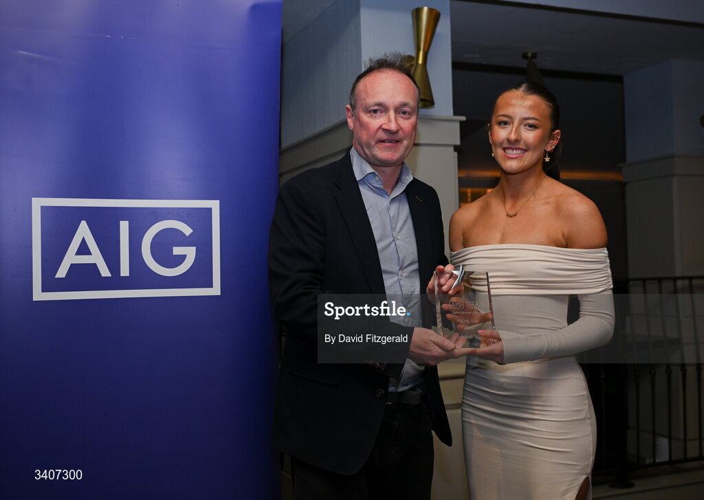 27 March 2026; Aimee Savage of TUS Midwest is presented with her 2026 AIG HEC Rising Stars award by John Gillick, Head of Consumer Marketing and Sponsorship, AIG Ireland, at the 2026 AIG HEC All-Stars and Rising Stars evening, at the Dublin Bonnington Hotel. Photo by David Fitzgerald/Sportsfile