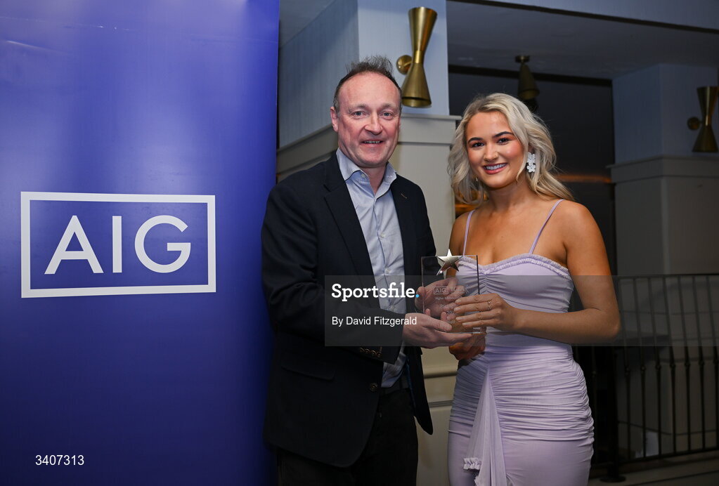 27 March 2026; Caoimhe Sheehan of SETU Carlow is presented with her 2026 AIG HEC Rising Stars award by John Gillick, Head of Consumer Marketing and Sponsorship, AIG Ireland, at the 2026 AIG HEC All-Stars and Rising Stars evening, at the Dublin Bonnington Hotel. Photo by David Fitzgerald/Sportsfile