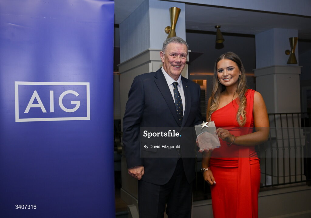 27 March 2026; Rachel McGrave of Queens University is presented with her 2026 AIG HEC Rising Stars award by Seán Fleming, Chairperson Ladies HEC at the 2026 AIG HEC All-Stars and Rising Stars evening, at the Dublin Bonnington Hotel. Photo by David Fitzgerald/Sportsfile