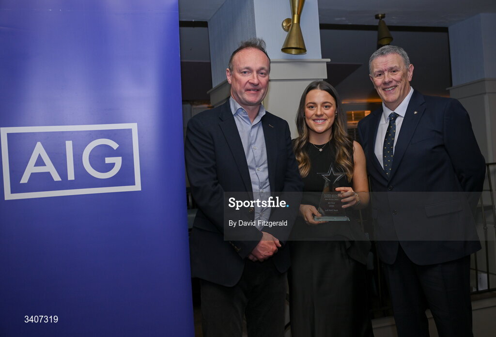27 March 2026; Lauren Murtagh of UCD is presented with her 2026 AIG HEC All Star award by Seán Fleming, Chairperson Ladies HEC and John Gillick, Head of Consumer Marketing and Sponsorship, AIG Ireland, at the 2026 AIG HEC All-Stars and Rising Stars evening, at the Dublin Bonnington Hotel. Photo by David Fitzgerald/Sportsfile
