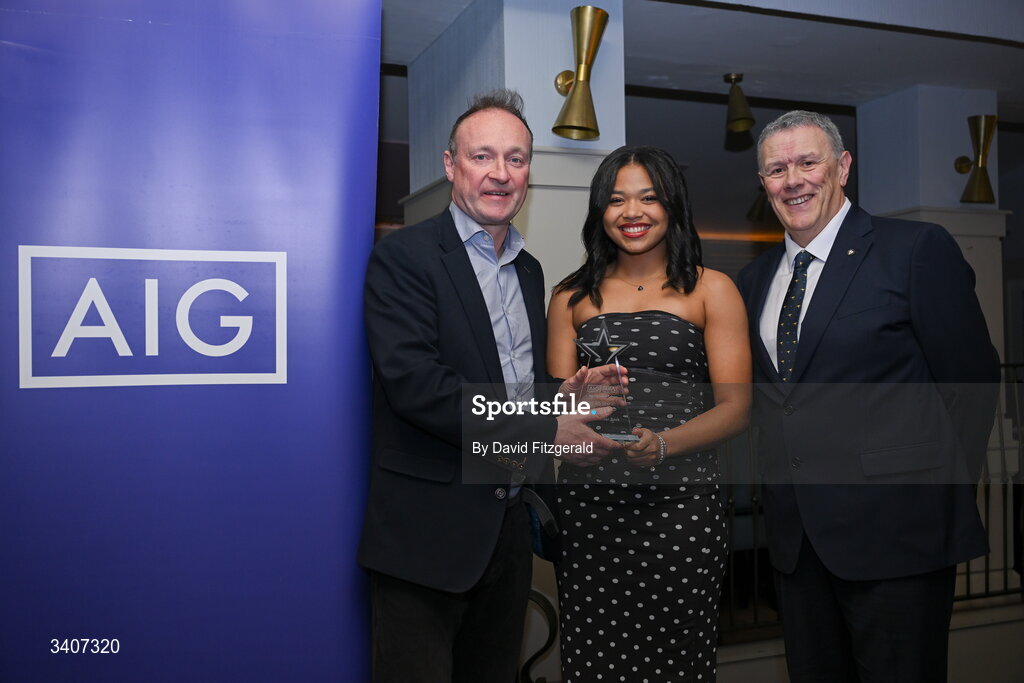 27 March 2026; Abigail Temple Asokuh of DCU is presented with her 2026 AIG HEC All Star award by Seán Fleming, Chairperson Ladies HEC and John Gillick, Head of Consumer Marketing and Sponsorship, AIG Ireland, at the 2026 AIG HEC All-Stars and Rising Stars evening, at the Dublin Bonnington Hotel. Photo by David Fitzgerald/Sportsfile
