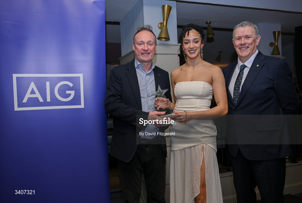 27 March 2026; Gráinne Gavin of TUD is presented with her 2026 AIG HEC All Star award by Seán Fleming, Chairperson Ladies HEC and John Gillick, Head of Consumer Marketing and Sponsorship, AIG Ireland, at the 2026 AIG HEC All-Stars and Rising Stars evening, at the Dublin Bonnington Hotel. Photo by David Fitzgerald/Sportsfile