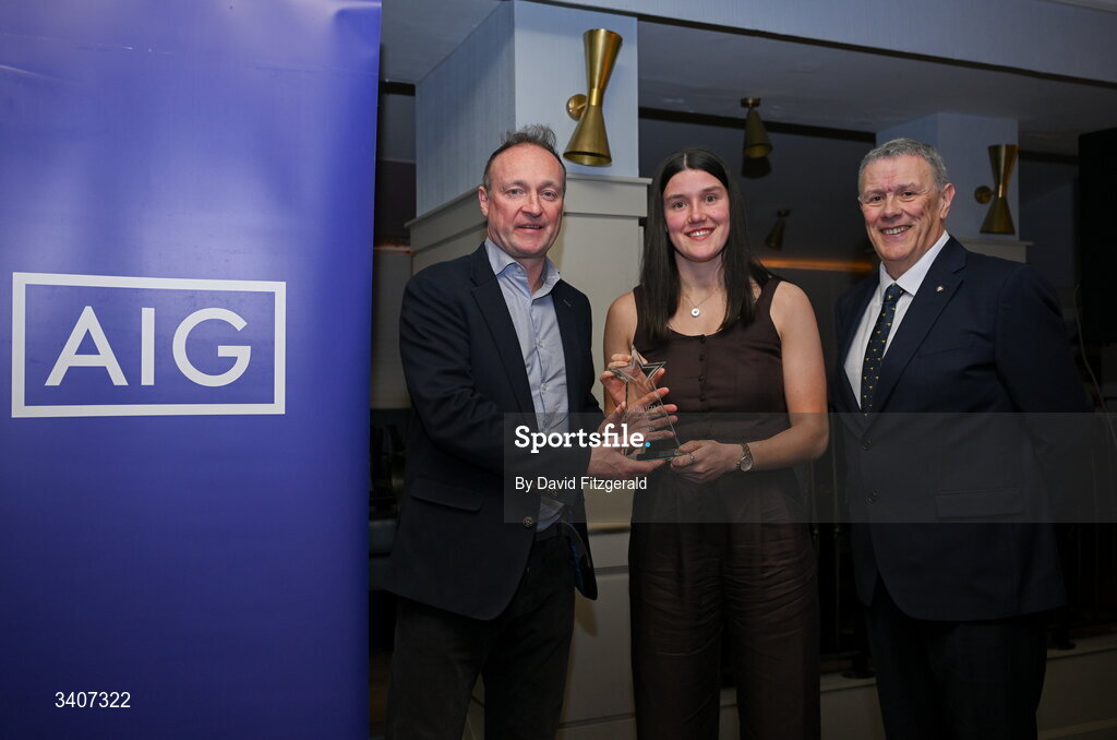 27 March 2026; Anna Dunlea of UCD is presented with her 2026 AIG HEC All Star award by Seán Fleming, Chairperson Ladies HEC and John Gillick, Head of Consumer Marketing and Sponsorship, AIG Ireland, at the 2026 AIG HEC All-Stars and Rising Stars evening, at the Dublin Bonnington Hotel. Photo by David Fitzgerald/Sportsfile
