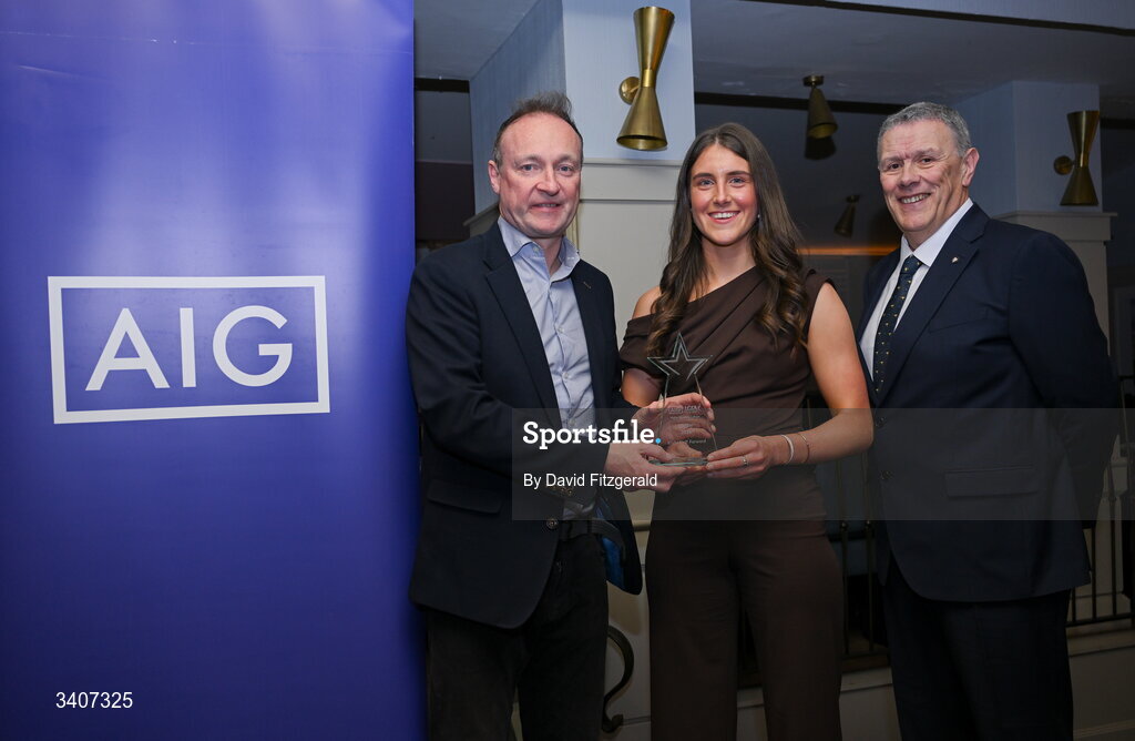 27 March 2026; Caoimhe Cregg of TUD is presented with her 2026 AIG HEC All Star award by Seán Fleming, Chairperson Ladies HEC and John Gillick, Head of Consumer Marketing and Sponsorship, AIG Ireland, at the 2026 AIG HEC All-Stars and Rising Stars evening, at the Dublin Bonnington Hotel. Photo by David Fitzgerald/Sportsfile