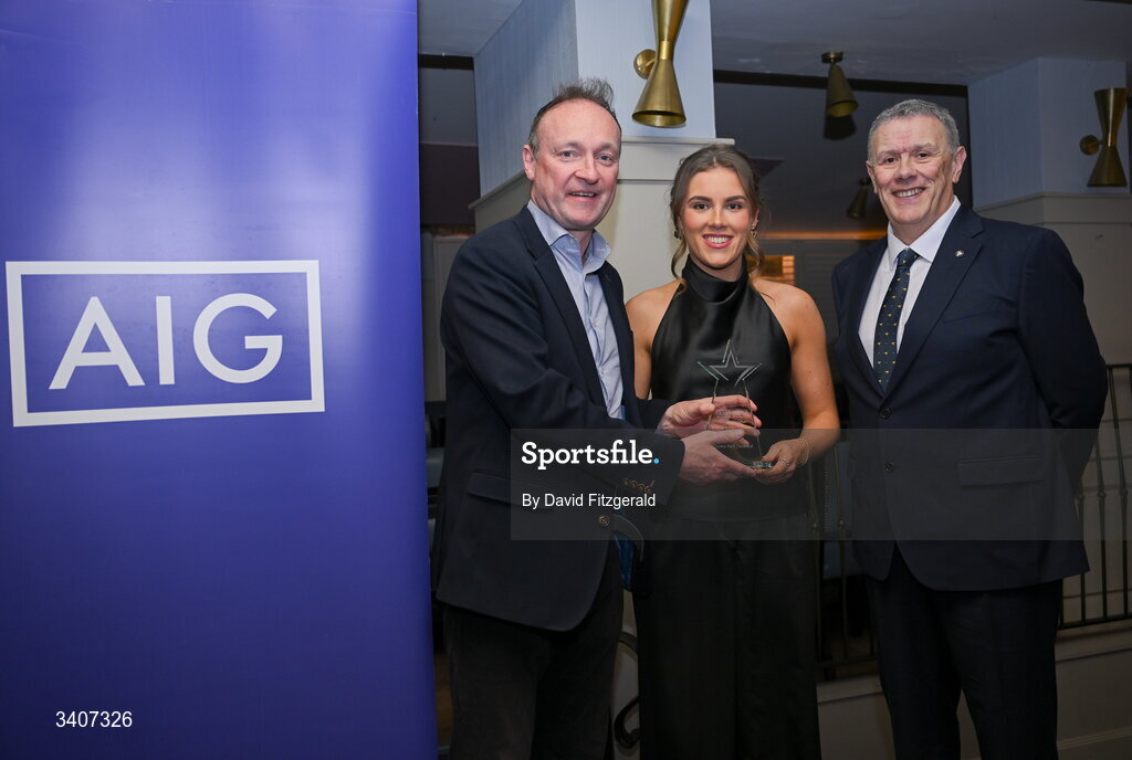 27 March 2026; Deirbhille Lynch of ATU Sligo is presented with her 2026 AIG HEC All Star award by Seán Fleming, Chairperson Ladies HEC and John Gillick, Head of Consumer Marketing and Sponsorship, AIG Ireland, at the 2026 AIG HEC All-Stars and Rising Stars evening, at the Dublin Bonnington Hotel. Photo by David Fitzgerald/Sportsfile