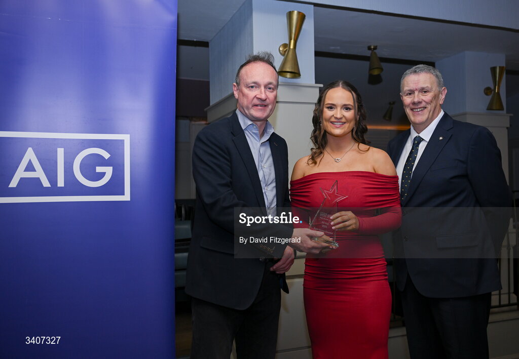 27 March 2026; Aisling Hanly of DCU is presented with her 2026 AIG HEC All Star award by Seán Fleming, Chairperson Ladies HEC and John Gillick, Head of Consumer Marketing and Sponsorship, AIG Ireland, at the 2026 AIG HEC All-Stars and Rising Stars evening, at the Dublin Bonnington Hotel. Photo by David Fitzgerald/Sportsfile